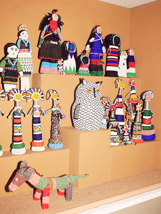 Rare and valuable Native American artifacts collected by Girard—such as these Hopi beadwork pieces—are displayed.